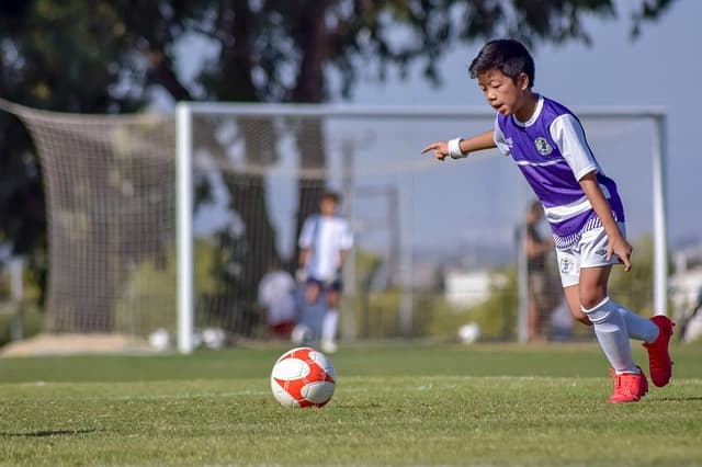 boy playing football