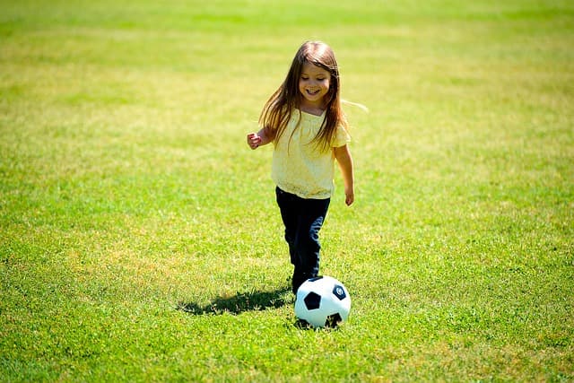 girl playing football